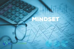 Grafici finanziari e calcolatrice, simbolo di Mindset Finanziario e pianificazione consapevole.